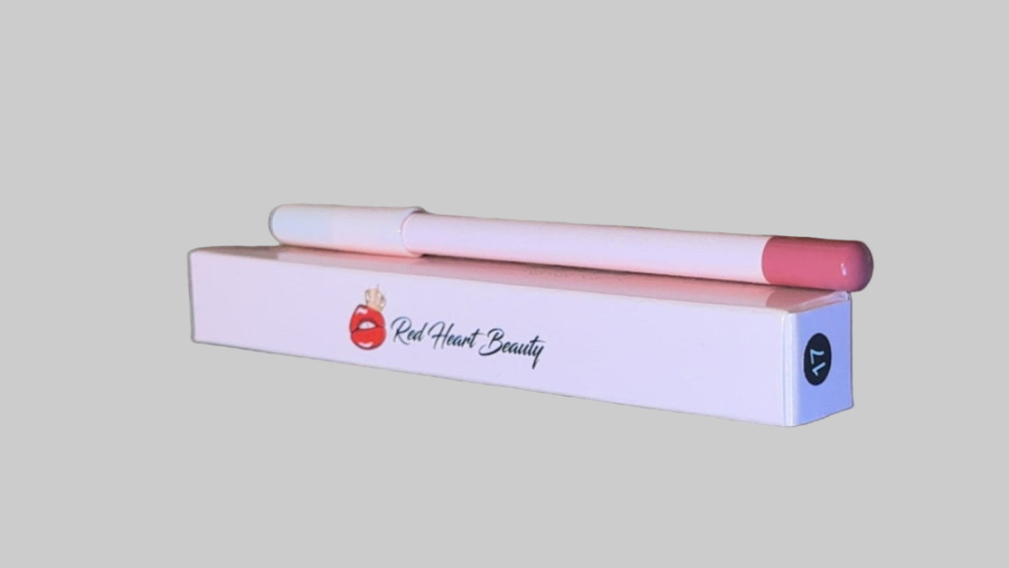 Pink lip gloss with applicator on a wooden surface