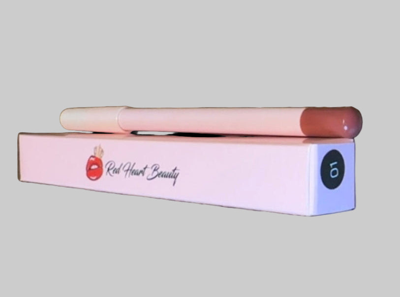 Lipstick and case on a wooden surface