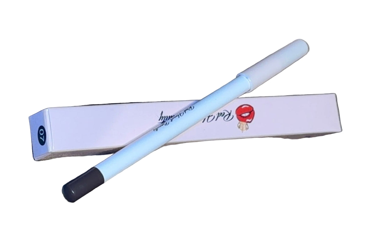 White pen with black cap on a textured surface