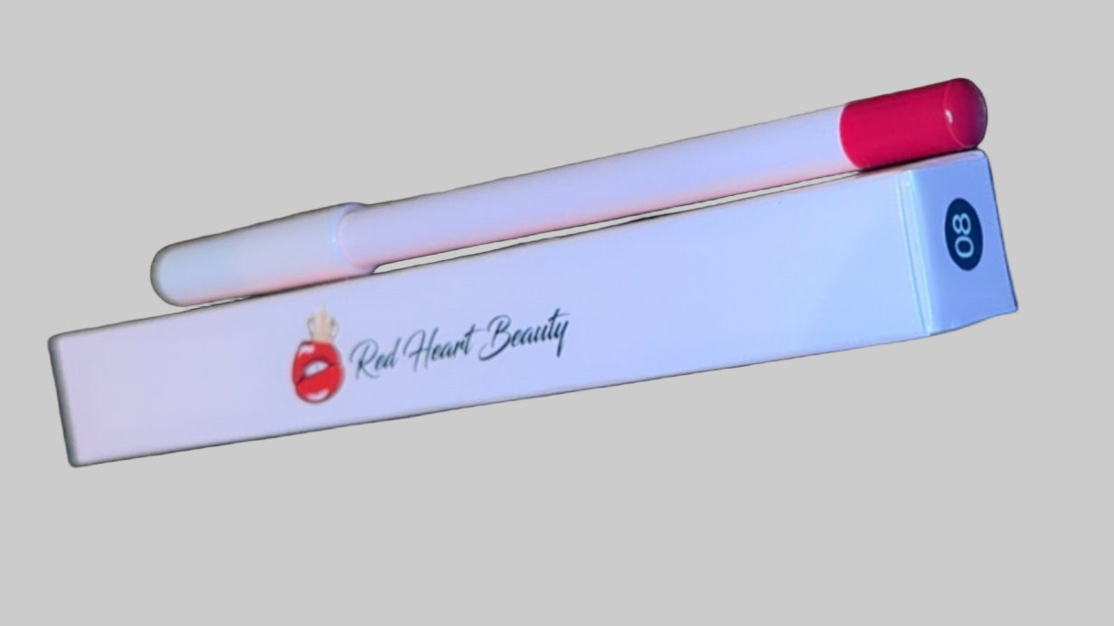 White pen with red cap and Olay logo on a textured surface